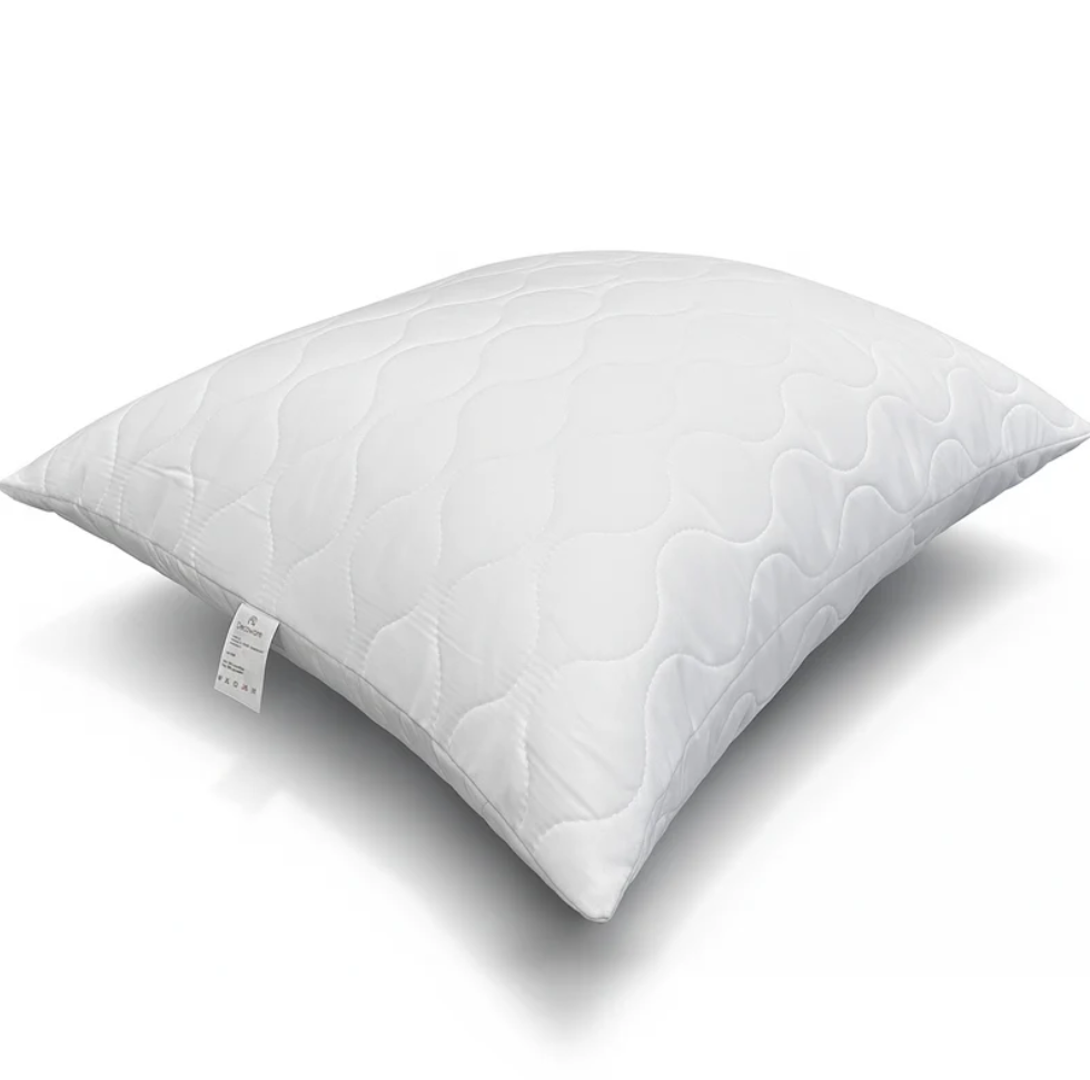 White quilted pillow with soft padded design for bedroom comfort